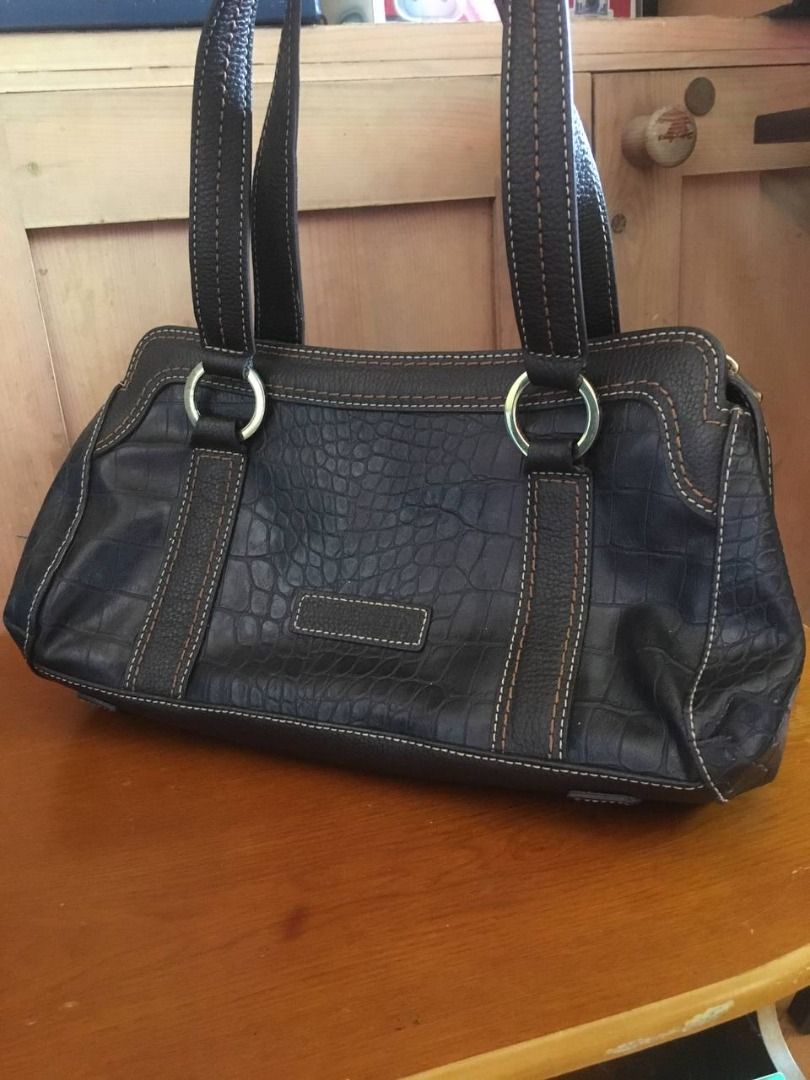 Anne Klein Y2K Handbag (Category: Luxury Bags & Wallets) located in Cavite. Submitted by xtina_m (Listing ID 1470771352, Image 1). Description: Anne Klein Y2K Handbag sourced from Instagram: - Material/Texture: Croc-embossed finish with contrast stitching - Straps: Dual shoulder straps with silver-tone rings - Closure: Secure top-zip closure - Interior: Fabric-lined. Spacious enough to fit medium-sized books. - Condition: Excellent body. Some pee
