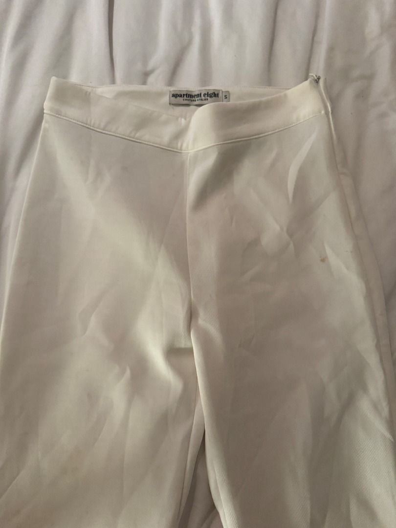 Apartment Eight White Ruffle Hem Pants Size S (Category: Jeans) located in Cebu City. Submitted by _t.rix (Listing ID 1470762237, Image 2). Description: - Brand: Apartment Eight - Size: Small - Color: Clean White - Details: Cute ruffled hems, tailored waistline, side zip closure - Style: Versatile for casual days or dressed up events - Condition: Excellent.