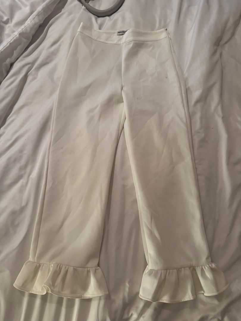 Apartment Eight White Ruffle Hem Pants Size S (Category: Jeans) located in Cebu City. Submitted by _t.rix (Listing ID 1470762237, Image 3). Description: - Brand: Apartment Eight - Size: Small - Color: Clean White - Details: Cute ruffled hems, tailored waistline, side zip closure - Style: Versatile for casual days or dressed up events - Condition: Excellent.