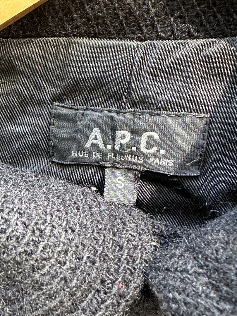 A.P.C. Paris Black Wool Textured Hidden Button Coat (Category: Coats, Jackets and Outerwear) located in Urdaneta. Submitted by redeemedcollective (Listing ID 1470868432, Image 3). Description: A.P.C. Paris Wool Coat Minimalist black wool coat from French fashion label A.P.C., featuring a textured exterior, structured collar, and concealed front button closure. • Black textured wool exterior • 100% wool • Made in France • Concealed button-front cl