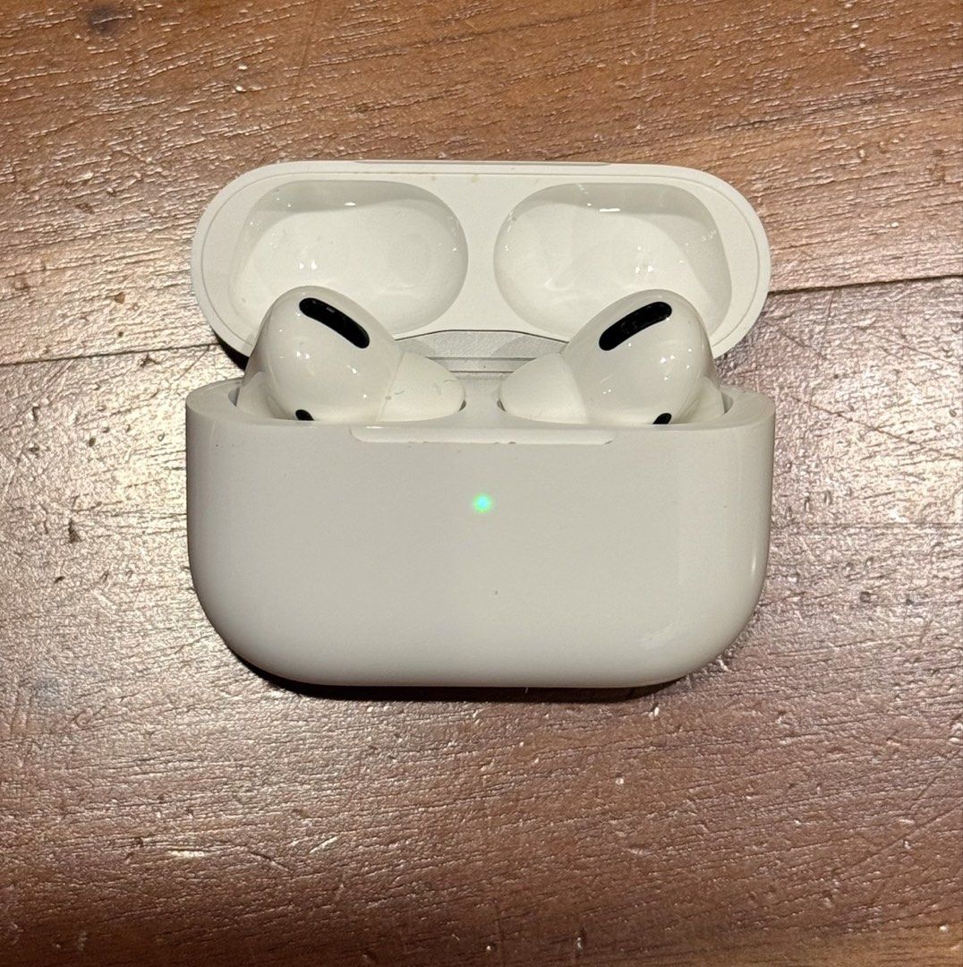 Apple AirPods Pro with UAG protective case (Category: Headphones & Headsets) located in Taguig. Submitted by s.tree (Listing ID 1470831818, Image 3). Description: Details: • Brand: Apple • Model: AirPods Pro 1st Generation • Model Number: A2084 • Color: White • Condition: Good, with normal signs of use • Includes original Apple charging case • Includes original UAG green protective case • Battery condition: Not recently tested • Original box: Sti