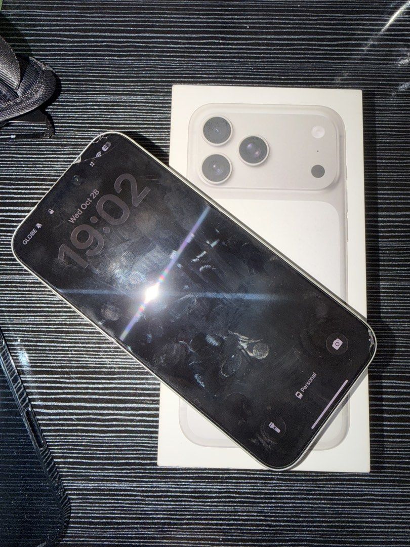 Apple iPhone 17 Pro Max with box (Category: iPhone 17 Series) located in Mandaluyong City. Submitted by oreotheshihtzu (Listing ID 1470930309, Image 3). Description: - Color: Natural Titanium - Camera: Triple camera setup - Port: USB-C charging port - Inclusions: Original retail box - Condition: fully functional and working normally.