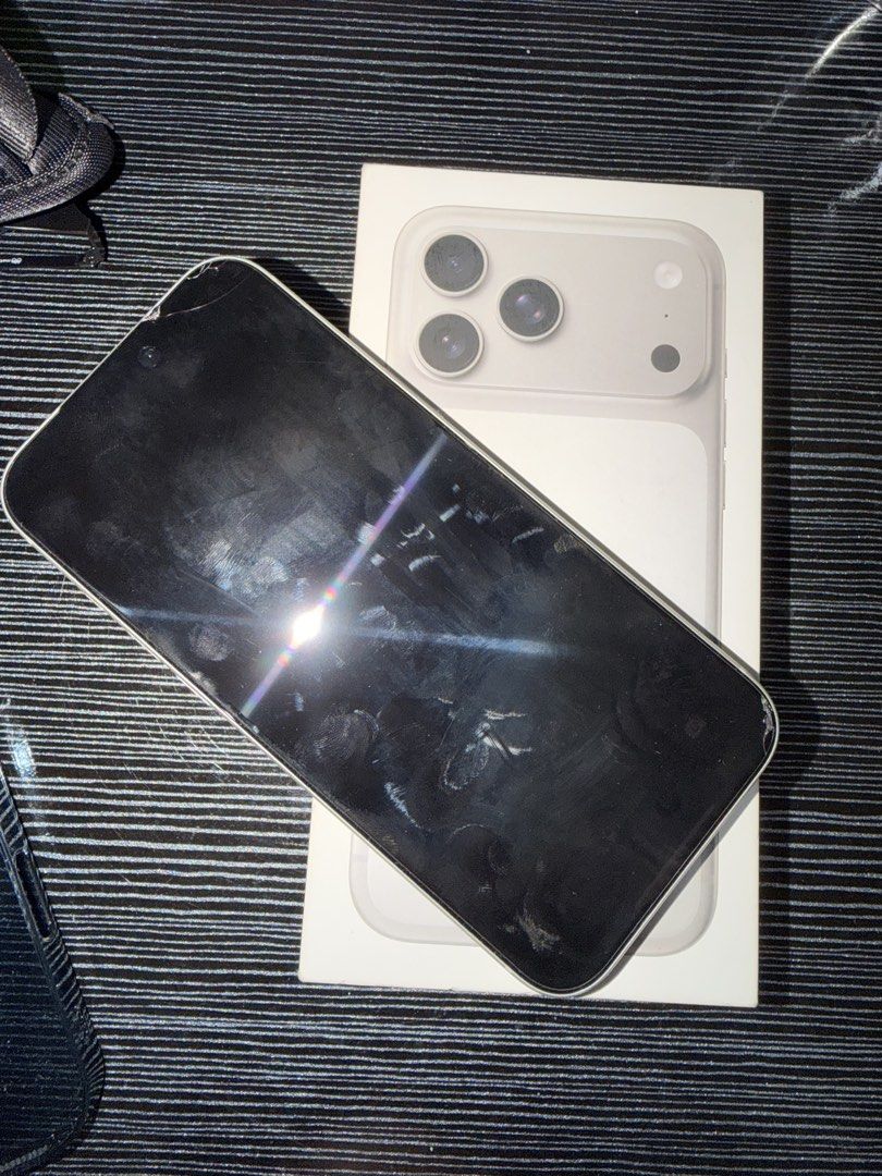 Apple iPhone 17 Pro Max with box (Category: iPhone 17 Series) located in Mandaluyong City. Submitted by oreotheshihtzu (Listing ID 1470930309, Image 2). Description: - Color: Natural Titanium - Camera: Triple camera setup - Port: USB-C charging port - Inclusions: Original retail box - Condition: fully functional and working normally.