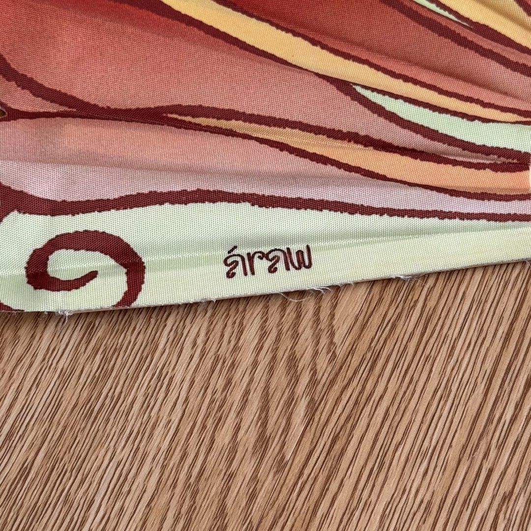 Araw Pamaypay Wooden Folding Fan with Abstract Pattern (Category: Other Accessories) located in Calamba. Submitted by quietarchive (Listing ID 1470811302, Image 2). Description: - Soldout on their website - Design: Abstract painted pattern in red, orange, green, and cream with a unique Thai text signature - Material: Sturdy bamboo ribs and handle - Size: Standard hand fan size - Use: Ideal stylish accessory for warm weather or home decor.