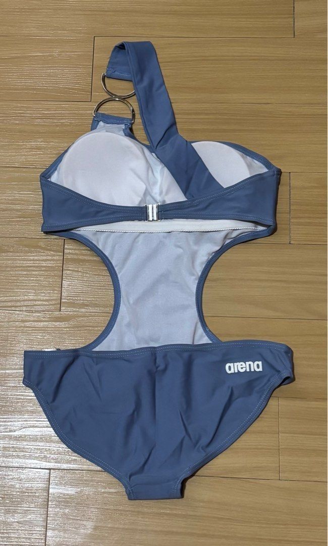 Arena One-Shoulder Swimsuit Medium - Large (Category: Bikinis & Swimsuits) located in Quezon City. Submitted by garagesale2026 (Listing ID 1470786471, Image 2). Description: - Brand new with tag - From Arena Retail Store - Fits Medium - Large - Metal buckle detail; Arena Logo on front - Color: Blue Grey - Material: Lycra.
