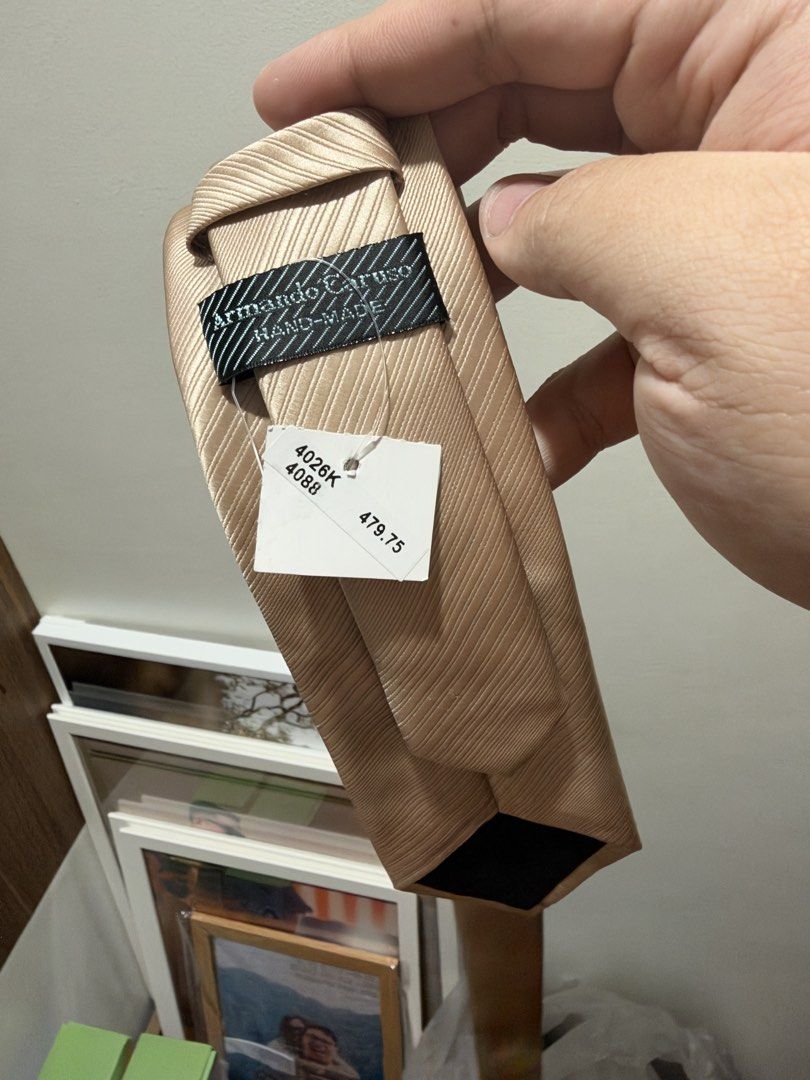 Armando Caruso Hand-Made Gold Necktie (Category: Ties) located in Manila. Submitted by dancco (Listing ID 1470899497, Image 3). Description: Bought at Landmark Brand new, never used Was only intended to be a reserve tie - Brand: Armando Caruso - Type: Hand-made necktie - Color: Gold with diagonal striped texture - Condition: Brand new, never worn - Tag: Original Landmark retail tag attached (₱479.75).