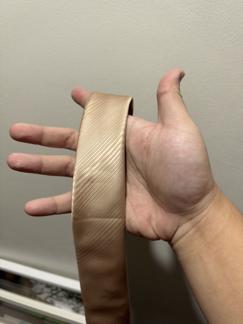 Armando Caruso Hand-Made Gold Necktie (Category: Ties) located in Manila. Submitted by dancco (Listing ID 1470899497, Image 1). Description: Bought at Landmark Brand new, never used Was only intended to be a reserve tie - Brand: Armando Caruso - Type: Hand-made necktie - Color: Gold with diagonal striped texture - Condition: Brand new, never worn - Tag: Original Landmark retail tag attached (₱479.75).