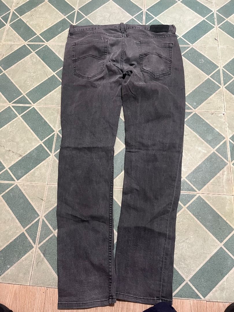 Armani Exchange Dark Grey Jeans (Category: Jeans) located in Pateros City. Submitted by m4ry.b0o (Listing ID 1470850224, Image 3). Description: - Brand: Armani Exchange (A|X) - Color: Classic dark grey wash - Closure: Button fly with branded metal button - Details: Interior waistband A|X logo label - Material: Sturdy, high-quality denim - Fit/Style: Versatile everyday wear.