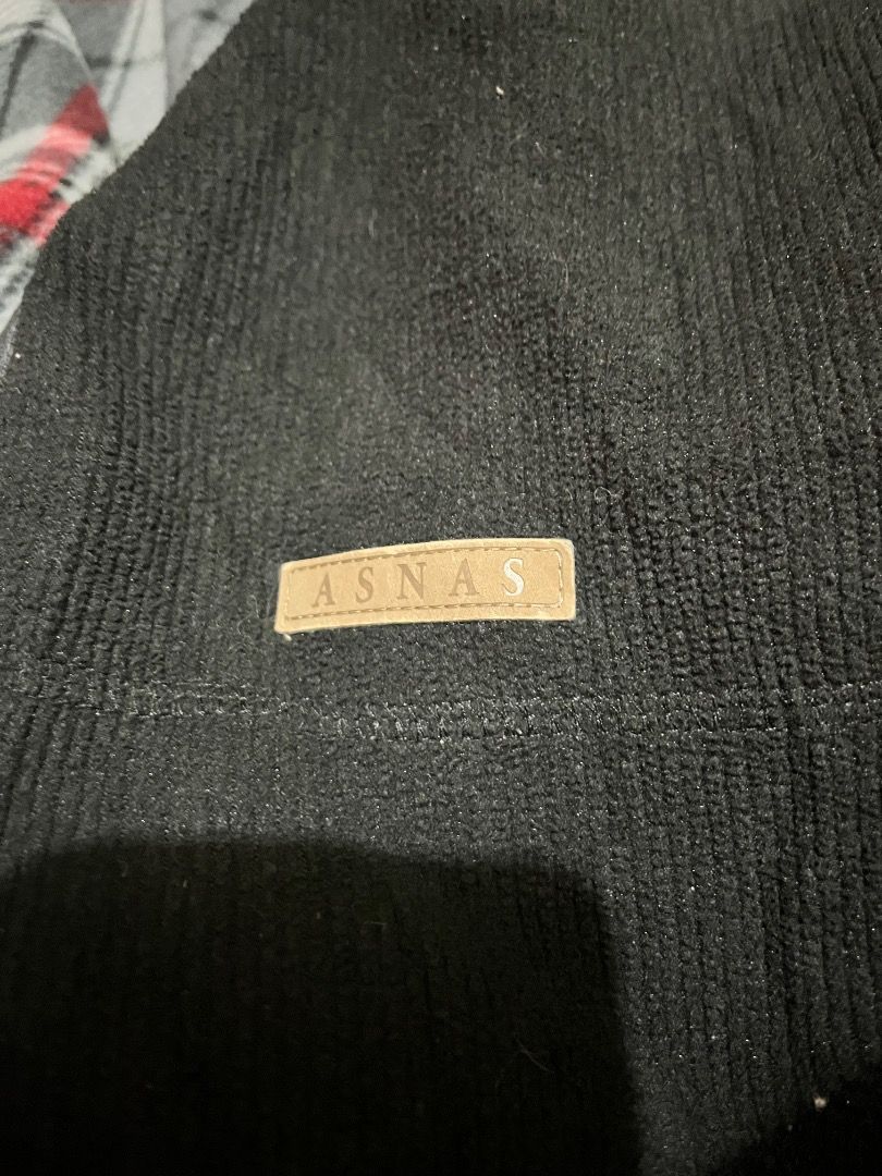 ASNAS Black Fleece Zip-Up Jacket (Category: Coats, Jackets and Outerwear) located in Caloocan City. Submitted by royal-phoenix (Listing ID 1470885231, Image 3). Description: - Brand: ASNAS - Size: Medium - Color: Black textured fleece - Details: Mock neck with plaid lining, embroidered chest logo - Pockets: Front zippered pockets with leather-like pulls - Comfort: Ribbed cuffs and hem to block the wind - Condition: Great for cool weather and ever