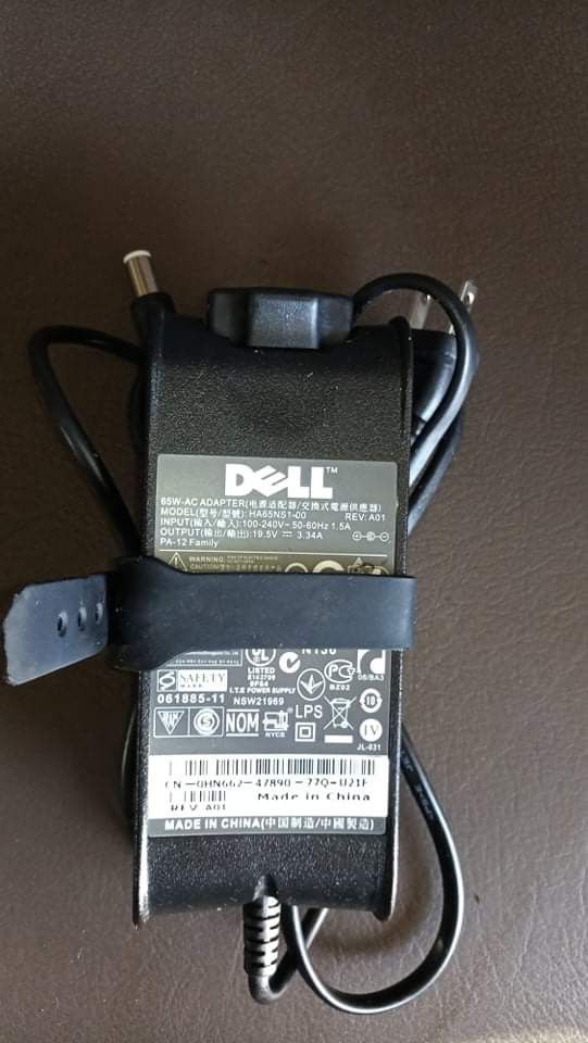 Assorted Adapter Power Supply Charger (Category: Chargers) located in Taguig. Submitted by grandfish_55ab5c (Listing ID 1470930026, Image 1). Description: Assorted adapter - Brand: Genuine Dell AC Adapter - Model: HA65NS1-00 - Power Output: 65W (19.5V / 3.34A) - Input: 100-240V (Universal/Global use) - Condition: Tested, 100% working, normal wear on casing - Inclusions: Power brick with attached cables and plug - Compatibility: Works with select 
