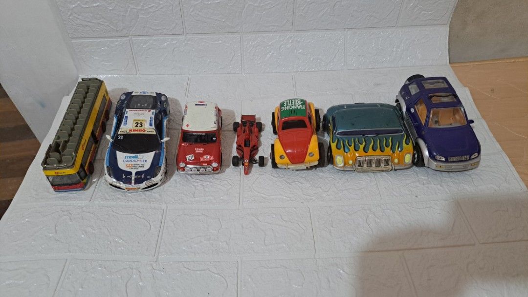 Assorted Diecast Toy Cars and Vehicles Bundle (Category: Vehicle & Diecast Models) located in Quezon City. Submitted by hersheejubilo (Listing ID 1470810622, Image 1). Description: - Bundle of 6 unique toy vehicles - Includes double decker city bus, rally car, classic red racecar, green roof beetle, custom flame car, and SUV - Features various sizes and styles - Sold together as a complete set - Ideal for kids' playtime or starter collections.