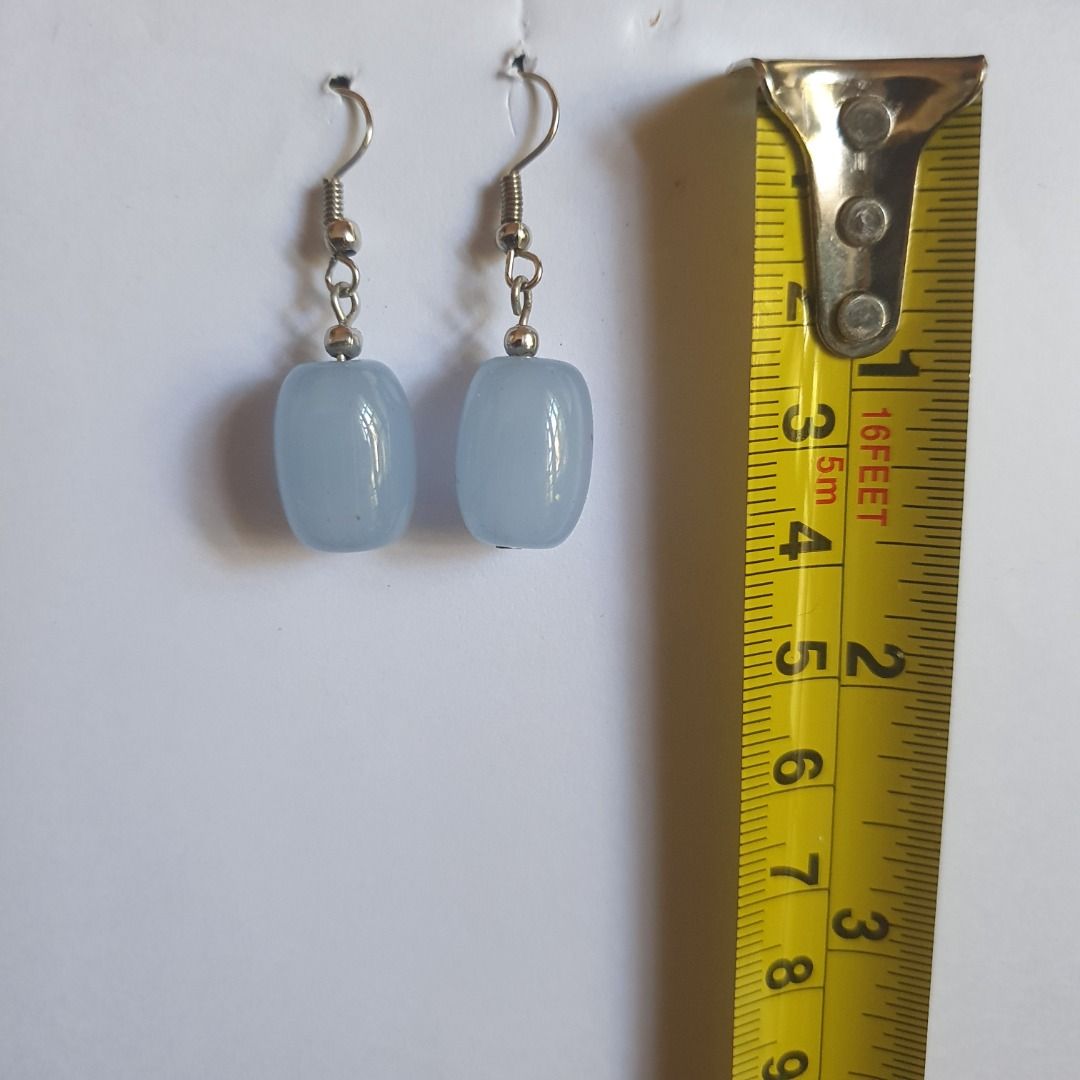 Assorted Fashion Earrings Bundle Set Php 100 (Category: Earrings) located in Caloocan City. Submitted by mma_222 (Listing ID 1470858276, Image 3). Description: - Bundle of 3 distinct pairs of statement earrings - Pair 1: Black faceted drops with faux pearl accents in copper-tone hardware - Pair 2: Layered fan-shaped perforated leaf designs in warm brown and yellow tones - Pair 3: Light blue translucent stone-like beads on silver hooks - Tomas Mor