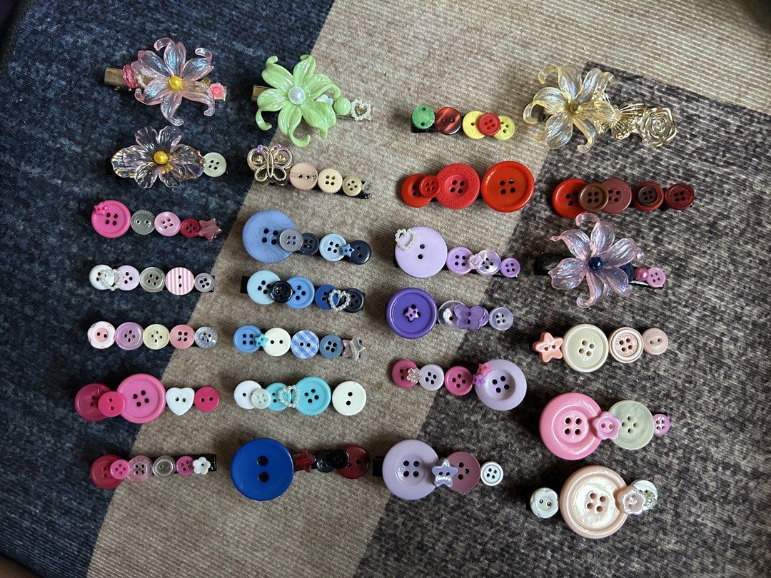 Assorted Handmade Button and Flower Hair Clips (Category: Hair Accessories) located in Manila. Submitted by ardol (Listing ID 1470767810, Image 1). Description: 15 each - Handcrafted hair clips featuring colorful buttons and resin flowers - Secured on sturdy metal alligator clips - Variety of mismatched designs and color combinations (pink, blue, purple, red, green) - Perfect for adding a playful pop of color to any hairstyle.