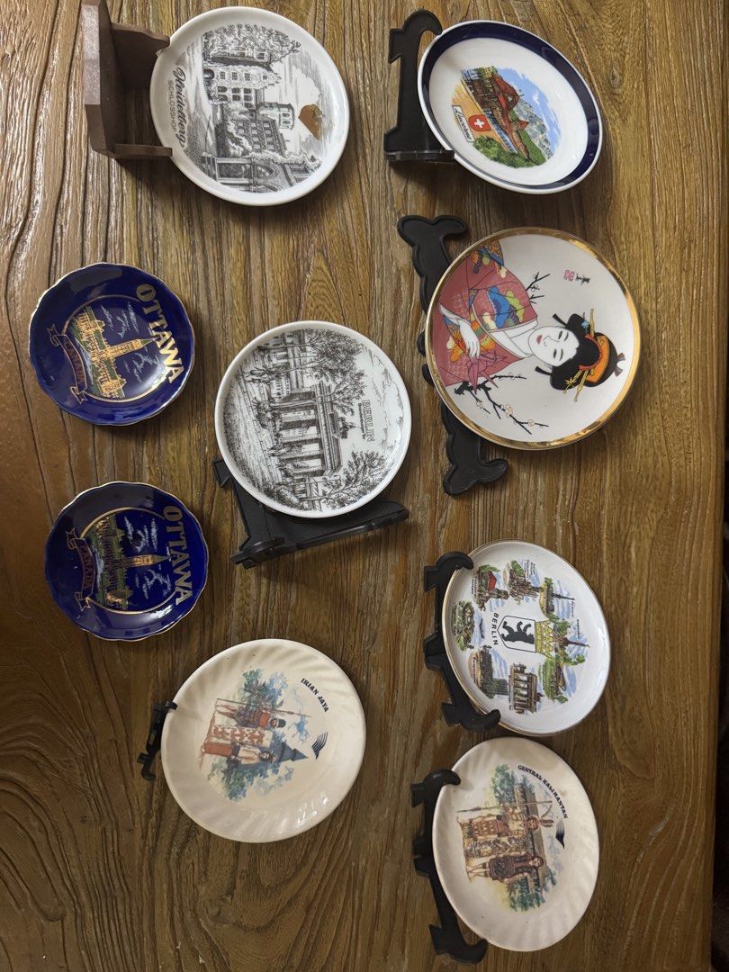 Assorted Vintage Souvenir Decorative Display Plates (Category: Dinnerware & Cutlery) located in Las Pinas. Submitted by emdjss (Listing ID 1470802316, Image 1). Description: - Souvenir plate collection from global destinations: Ottawa, Berlin, Heidelberg, Lucerne, Japan, Irian Jaya, and Central Kalimantan - Mix of black & white sketches and vibrant full-color illustrations - Various sizes and unique designs available - Includes selected black dis