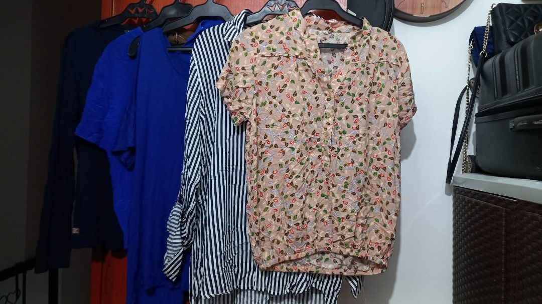 Assorted Women's Tops Shirts Bundle (Category: Shirts) located in Pasig City. Submitted by kathee88 (Listing ID 1470849084, Image 2). Description: - Set of 5 versatile women's tops for daily casual wear - Includes: floral short-sleeve blouse, black & white striped button-up, bright blue tee, blue top, and dark long-sleeve shirt - Great mix of styles and colors to easily match your outfit - Closet clear-out bundle – selling all 5 pieces together -