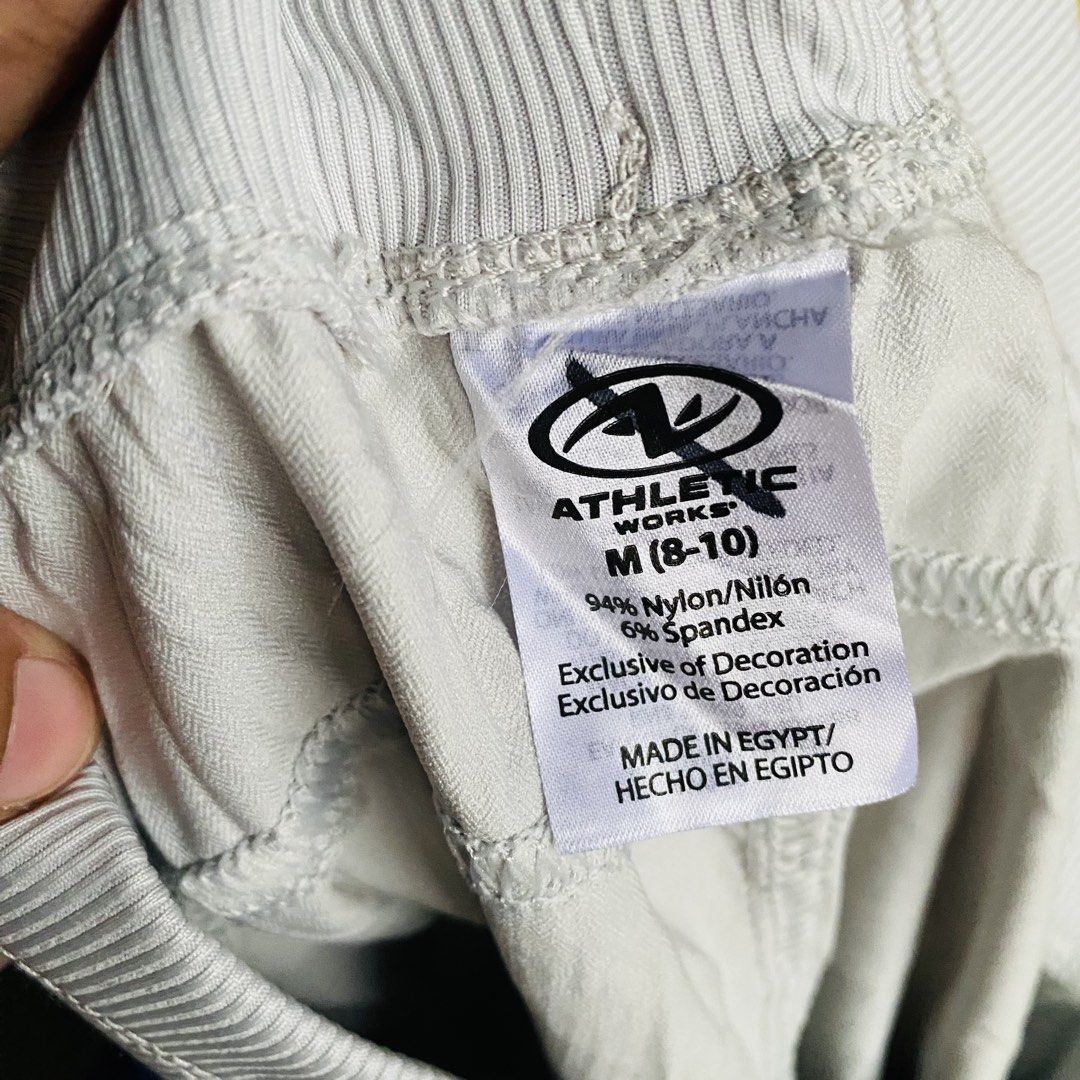 Athletic Works Nylon Spandex Athletic Shorts (Category: Shorts) located in Caloocan City. Submitted by lovemyclothes21 (Listing ID 1470843421, Image 3). Description: - Brand: Athletic Works - Color: Grey - Size: Medium (PH 8-10 / Tagged 32-34) - Material: 94% Nylon, 6% Spandex (with stretch) - Features: Wide ribbed waistband, secure front zipper pocket on the right - Fit: Regular fit, ideal for workouts or casual everyday wear.