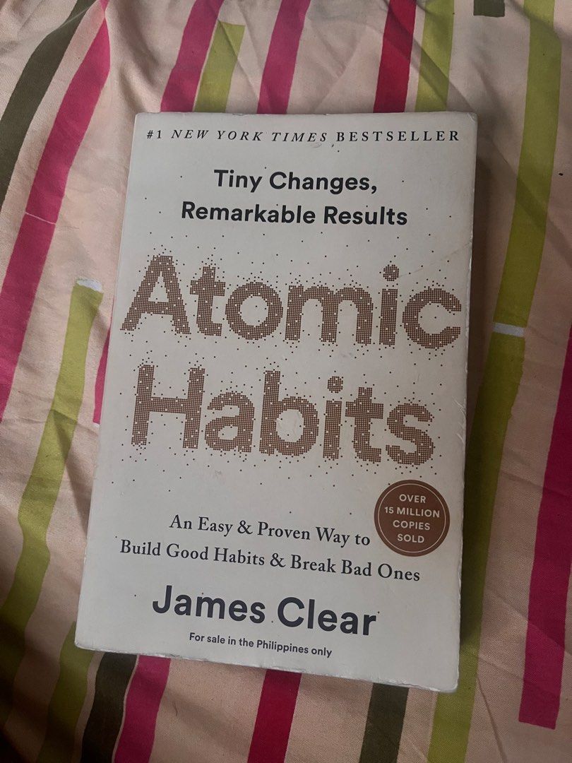 Atomic Habits by James Clear Paperback (Category: Storybooks) located in Manila. Submitted by cloudinech32884 (Listing ID 1470753236, Image 1). Description: - Title: Atomic Habits by James Clear - Edition: Philippine Edition (Paperback) - Condition: Read once, solid and well-maintained shape - Highlights: Bestseller on building good habits and breaking bad ones - Benefit: Proven strategies for personal growth and better daily routines.