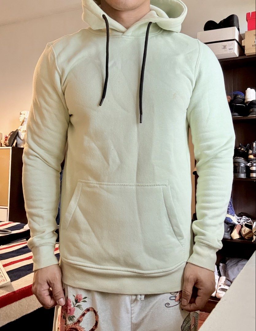 Authentic Bershka Mint Green Hoodie Pullover (Category: Hoodies) located in Mandaluyong City. Submitted by material_boi (Listing ID 1470775698, Image 3). Description: Store bought. Used less than 5 times. Made in Pakistan.Color is like mint green or pistachio green. Size XS on tag approx 19 inches wide and 26 inches long. Front kangaroo pocket, matching black drawstrings, and ribbed cuffs and hem. Small L1K3 text detail printed on the hood. Perfe