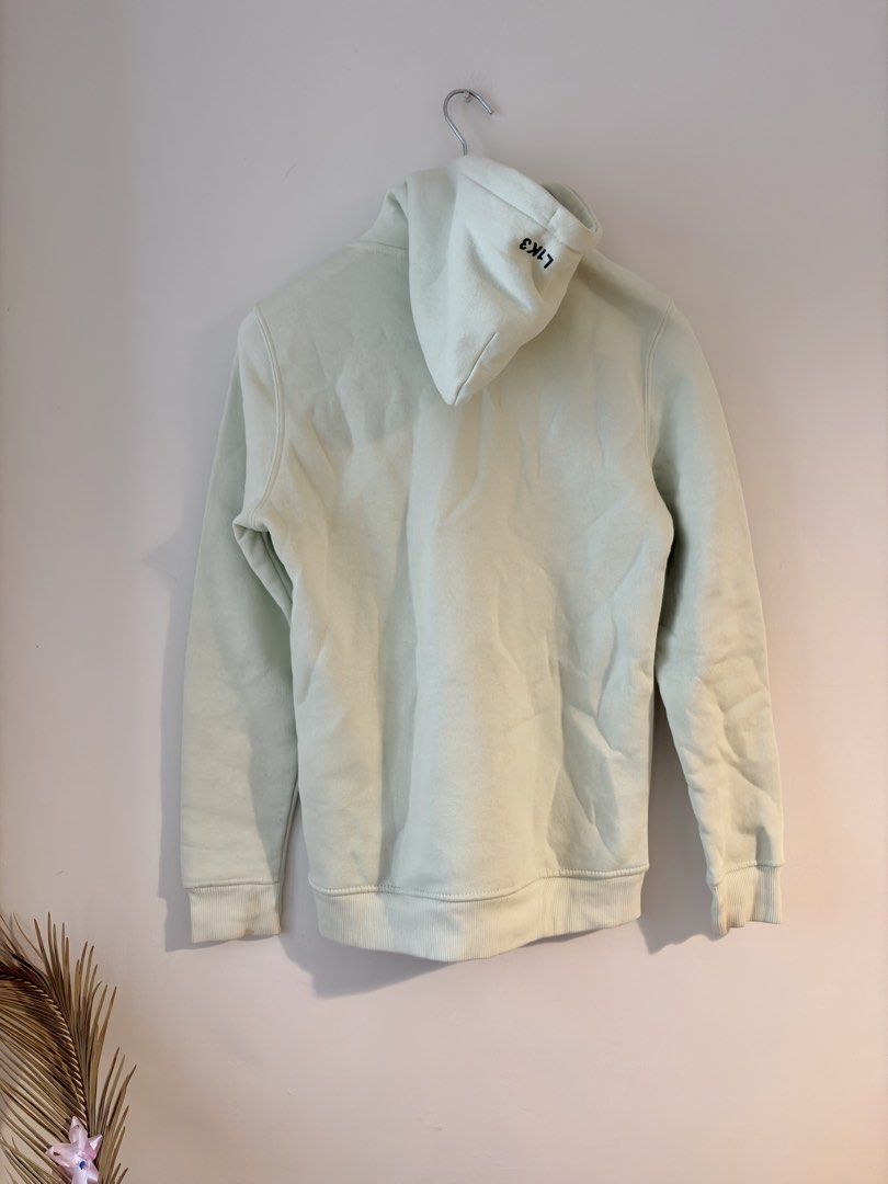 Authentic Bershka Mint Green Hoodie Pullover (Category: Hoodies) located in Mandaluyong City. Submitted by material_boi (Listing ID 1470775698, Image 2). Description: Store bought. Used less than 5 times. Made in Pakistan.Color is like mint green or pistachio green. Size XS on tag approx 19 inches wide and 26 inches long. Front kangaroo pocket, matching black drawstrings, and ribbed cuffs and hem. Small L1K3 text detail printed on the hood. Perfe