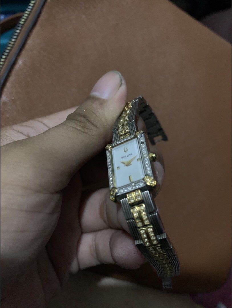 Authentic Bulova Two-Tone Crystal Watch — Complete with Box & Papers (Category: Women's Watches) located in San Juan, La Union. Submitted by declutteringog7 (Listing ID 1470844646, Image 2). Description: 🕰️ Authentic Bulova Two-Tone Crystal Watch — Complete with Box & Papers Price: ₱2,500 lp 📝 Details: • ✅ Brand: Bulova — Genuine / Authentic • ✅ Style: Elegant rectangular two-tone case with crystal accents • Mother-of-pearl dial • Classic vinta