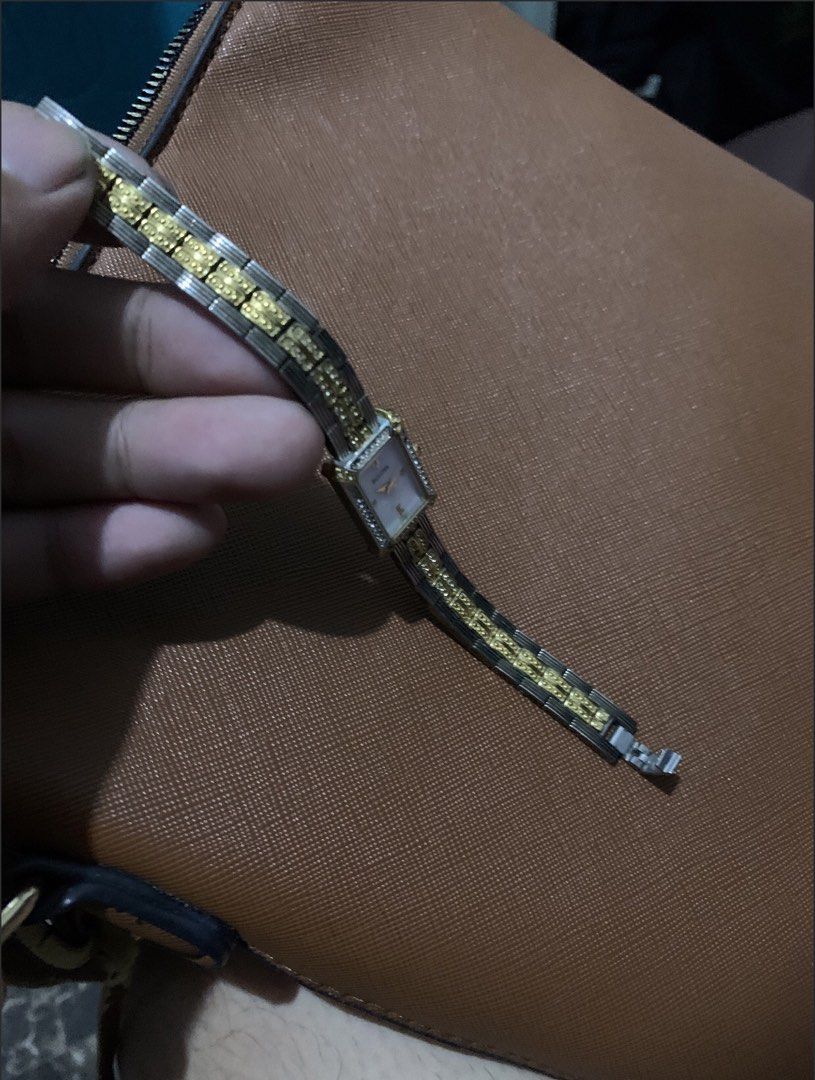 Authentic Bulova Two-Tone Crystal Watch — Complete with Box & Papers (Category: Women's Watches) located in San Juan, La Union. Submitted by declutteringog7 (Listing ID 1470844646, Image 3). Description: 🕰️ Authentic Bulova Two-Tone Crystal Watch — Complete with Box & Papers Price: ₱2,500 lp 📝 Details: • ✅ Brand: Bulova — Genuine / Authentic • ✅ Style: Elegant rectangular two-tone case with crystal accents • Mother-of-pearl dial • Classic vinta