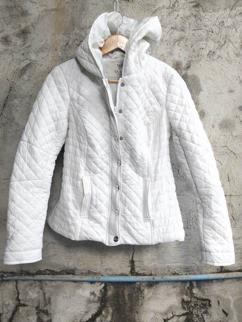 AUTHENTIC GUESS White Quilted Hooded Jacket (Category: Babies & Kids Fashion) located in Malolos. Submitted by rthrift2026 (Listing ID 1470877340, Image 1). Description: Brand: GUESS (100% Authentic / Legit with complete wash & style tags) Size: Medium (M) | EU 38 | UK 8 Color: Crisp White Condition:Like New Details: Diamond quilted pattern, full zipper with snap button closure, side pockets, and a cozy hood. Clean and ready to wear.