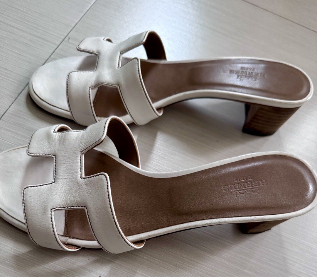 Authentic Hermès Oasis Sandals – White/Ivory | Size 39 (Category: Sneakers & Footwear) located in Pasig City. Submitted by jjjj0987 (Listing ID 1470769462, Image 1). Description: Authentic Hermès Oasis sandals in white/ivory leather. Condition: Pre-loved, with visible signs of use and wear, as shown in the actual photos. Item has been stored and needs cleaning. 📌 Please refer to all photos for the actual condition and manage expectations. 📩 Add