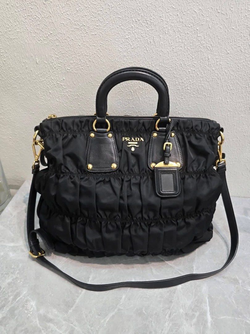 💯Authentic Prada Tessuto (Category: Luxury Bags & Wallets) located in General Santos City (Dadiangas). Submitted by braverabbit.67 (Listing ID 1470770244, Image 1). Description: - Authentic💯 - Pradah Tessuto Guafre Ruched Nylon Tote Bag 2-Way - Large size - In excellent condition💯✅.