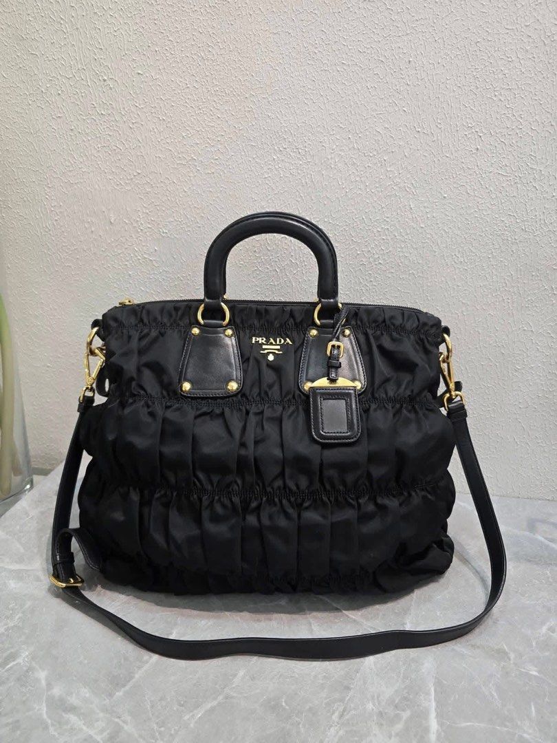 💯Authentic Prada Tessuto (Category: Luxury Bags & Wallets) located in General Santos City (Dadiangas). Submitted by braverabbit.67 (Listing ID 1470770244, Image 2). Description: - Authentic💯 - Pradah Tessuto Guafre Ruched Nylon Tote Bag 2-Way - Large size - In excellent condition💯✅.