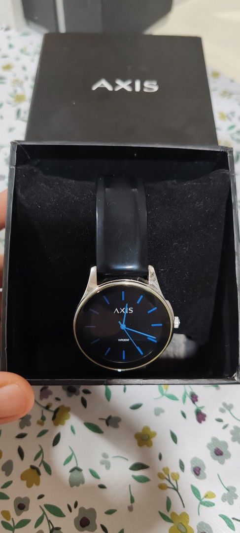 Axis H3194 Quartz Watch with Black Strap (Category: Men's Watches) located in Makati City. Submitted by plazatienda (Listing ID 1470751223, Image 1). Description: - Brand: Axis (Model: H3194) - Movement: Reliable Japanese quartz movement - Dial: Matte black with striking blue hour markers - Build: Stainless steel case back with 30M water resistance - Strap: Comfortable black silicone strap with buckle closure - Inclusion: Comes with original blac