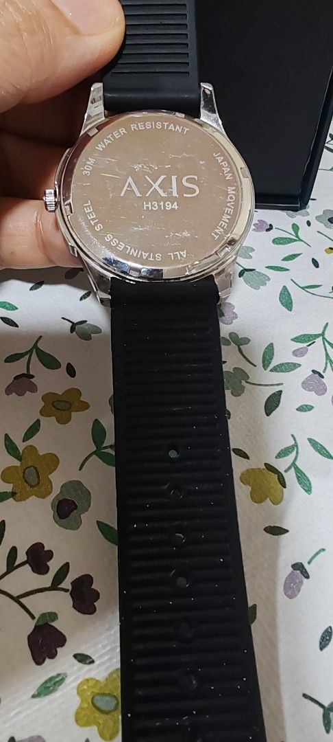 Axis H3194 Quartz Watch with Black Strap (Category: Men's Watches) located in Makati City. Submitted by plazatienda (Listing ID 1470751223, Image 3). Description: - Brand: Axis (Model: H3194) - Movement: Reliable Japanese quartz movement - Dial: Matte black with striking blue hour markers - Build: Stainless steel case back with 30M water resistance - Strap: Comfortable black silicone strap with buckle closure - Inclusion: Comes with original blac