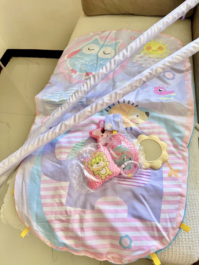 Baby Activity Play Mat Multifunctional (Category: Infant Playtime) located in Las Pinas. Submitted by lykarabino (Listing ID 1470787045, Image 2). Description: ‼️Baby Activity Play Mat Multifunctional‼️ - Suitable for infants 3 months and older - Padded play mat featuring adorable animal illustrations (owl, sun, hedgehog) - Includes two sturdy support arches - Comes with engaging hanging toys and a baby-safe mirror - Ideal for tummy time and earl