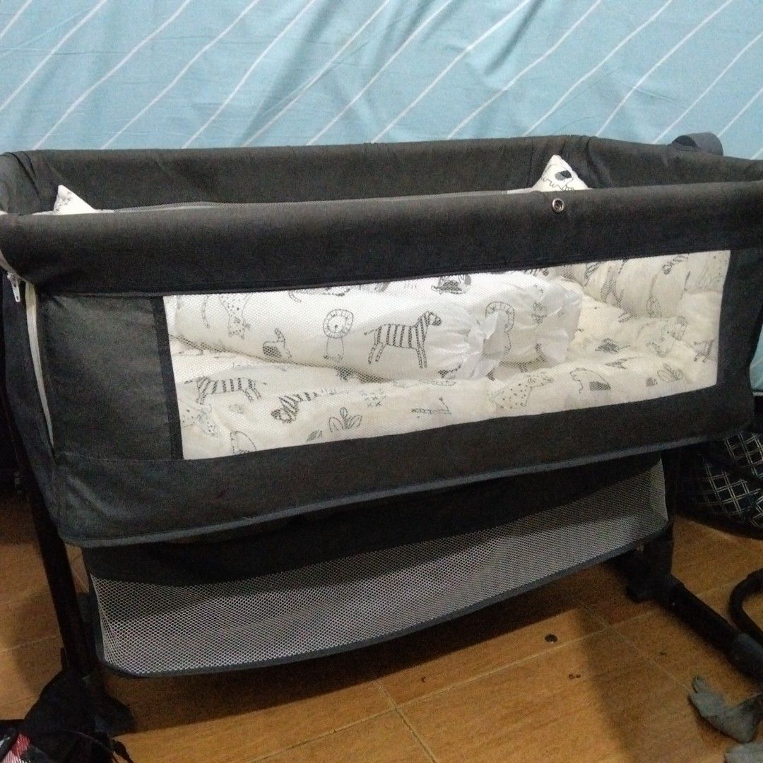 Baby Crib (Category: Cots & Cribs) located in Paranaque City. Submitted by rjaymagdael (Listing ID 1470773089, Image 2). Description: - Safety & Comfort: Breathable mesh sides for great ventilation - Included: Padded mattress, bumper pads, and 2 long bolsters - Condition: Selling as is. Need wash. - Perfect all-in-one setup for your little one.