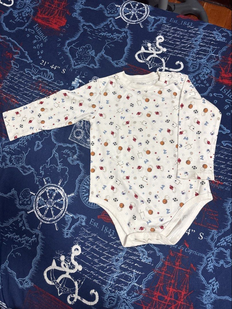 Baby Gap & Sonoma Baby Bodysuit Romper Bundle (Category: Babies & Kids Fashion) located in Quezon City. Submitted by iya_handovers (Listing ID 1470829421, Image 2). Description: - Set of 2 cute and comfortable long-sleeve baby rompers - Piece 1: Sonoma white bodysuit with all-over sports ball print (w/ removable stain) - Piece 2: Baby Gap blue plaid button-down collared shirt romper - Made with soft, baby-friendly cotton material - Convenient sna