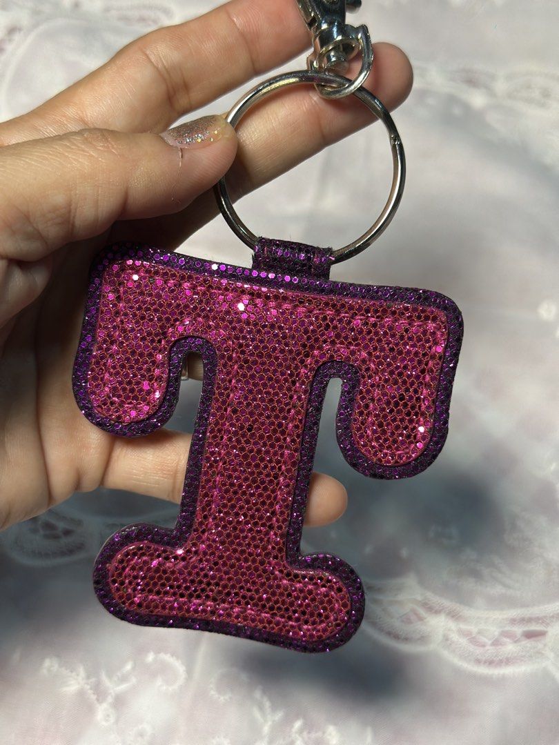 Back to back Letter T keychain- bag tag (Category: Everything Else Others) located in Davao. Submitted by favoritepreloved (Listing ID 1470817851, Image 3). Description: 💜 very good condition.