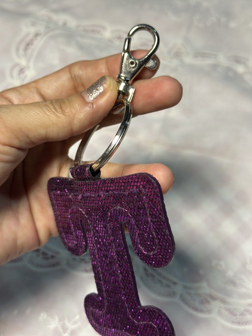 Back to back Letter T keychain- bag tag (Category: Everything Else Others) located in Davao. Submitted by favoritepreloved (Listing ID 1470817851, Image 2). Description: 💜 very good condition.