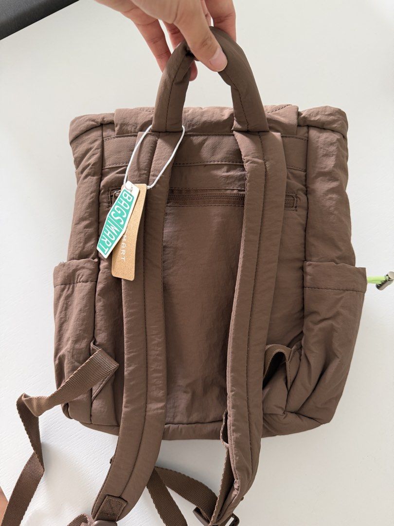 Bagsmart Quilted Brown Backpack with Lime Green Lining (Category: Backpacks) located in Cebu City. Submitted by jnnwright (Listing ID 1470926939, Image 2). Description: - Brand: Bagsmart - Color: Brown with lime green inner lining - Condition: Brand new with original tag attached - Design: Quilted wave pattern on the flap and front pocket - Closure: Drawstring and magnetic snap - Features: Multiple interior and exterior pockets, adjustable should