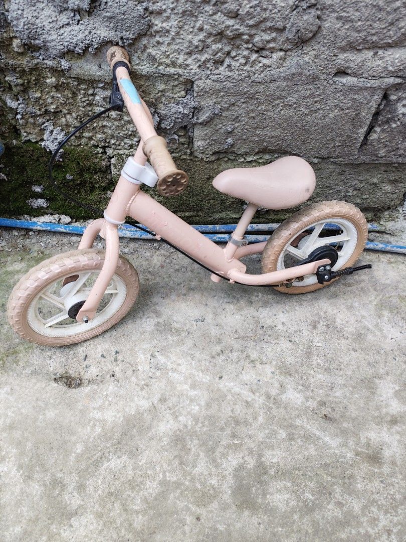 Balancing Bike Japan surplus (Category: Bicycles) located in Manila. Submitted by aks_japansurplus30 (Listing ID 1470901694, Image 1). Description: - Pink balance bike ideal for toddlers learning to ride - Features a handy handlebar handbrake and a black kickstand - Solid rubber wheels with stylish white rims - Adjustable seat height to grow with your child - Light pink frame with minor scuffs from outdoor play - Rubber handle grips show some dir
