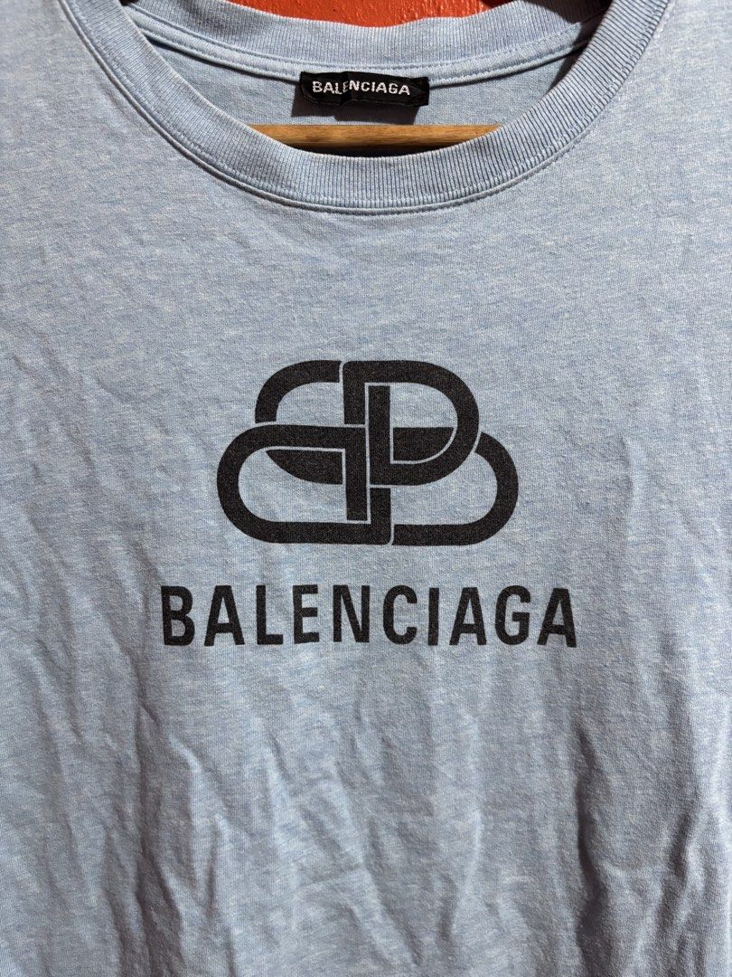Balenciaga BB Logo Light Blue T-Shirt (Category: Luxury Apparel) located in Naga. Submitted by ajrc.shop (Listing ID 1470845949, Image 2). Description: Balenciaga Tshirt ✅Size: M ✅Width: 21 ✅Length: 27 ✅Color Rate: 9/10 ✅Issue: None ✅Need Wash ✅Location: Bicol Naga City, Camarines Sur ✅Courier: J&T Express/Flash Express ✅MOP: Gcash only.
