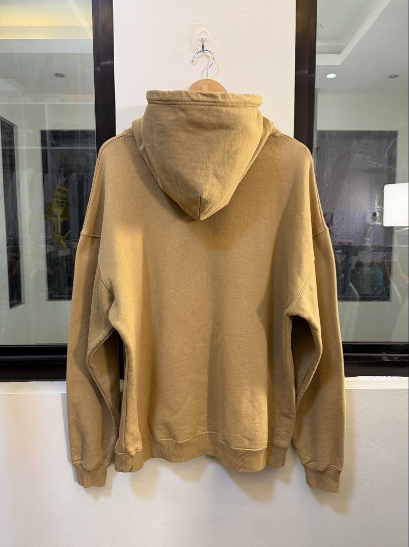 Balenciaga Pullover Hooded Sweatshirt (Category: Coats, Jackets and Outerwear) located in Paranaque City. Submitted by preluxeshop_ph (Listing ID 1470816809, Image 3). Description: Brand: Balenciaga •Style: Pullover Hooded Sweatshirt / Hoodie •Color: Camel / Desert Tan •Design Features: Black “b@lencỉ@g@“-style graphic text across the chest, attached hood, and front kangaroo pocket •Made In: Portugal •Condition: Pre-loved / Excellent condition.