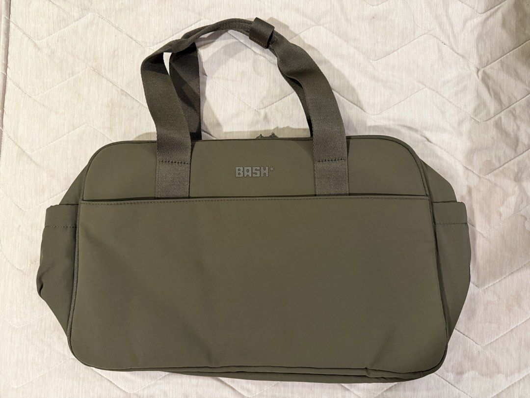 BASH Expedition Mini Weekender Mono in Terra (Category: Tote Bags) located in Imus. Submitted by yummyfinds (Listing ID 1470851022, Image 1). Description: Brand new, unused and kept only Originally bought for ₱2,650 - Brand: BASH - Color: Terra - Features: Sturdy top handles, dual zipper closure, and branded hardware - Storage: Spacious interior compartments for your daily essentials - Inclusions: Comes with original BASH dust bag and ziplock pac