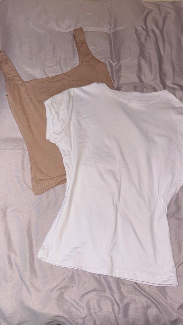 Basic Tops Bundle White T-shirt and Nude Tank Top (Category: Sleeveless) located in Quezon City. Submitted by shrlane (Listing ID 1470889457, Image 1). Description: - best fit S-M -Bundle includes: 1 plain white short-sleeve tee (round neck) and 1 nude brown tank top (square neck with thick straps) - Fabric: Soft and stretchy for all-day comfort - Styling: Super versatile basics, perfect for layering or wearing on their own with jeans or shorts -