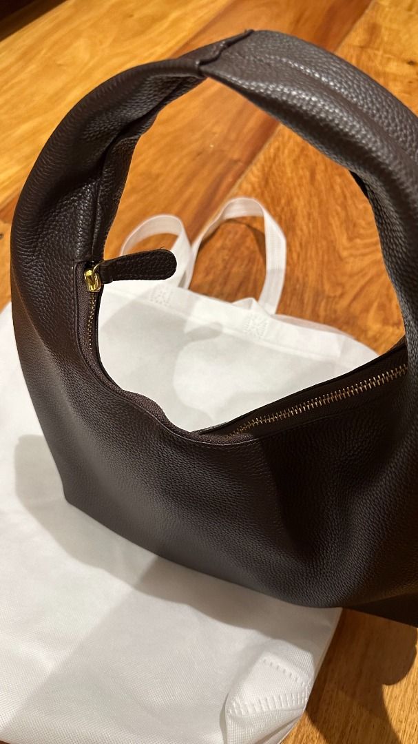 BBT Dark Brown Pebbled Leather Hobo Shoulder Bag (Category: Shoulder Bags) located in Mandaluyong City. Submitted by bakedzt (Listing ID 1470809770, Image 2). Description: Big Bag Theory Lulu Puffy Midi Hobo - Real leather (not faux/vegan) - Fully-lined with cotton fabric - Approx. 16" Height x 2.5" Depth x 13" Width. Approx. 8" Handle Drop. *Please expect creasings, markings, and texture/color variations natural to the leather material. They are