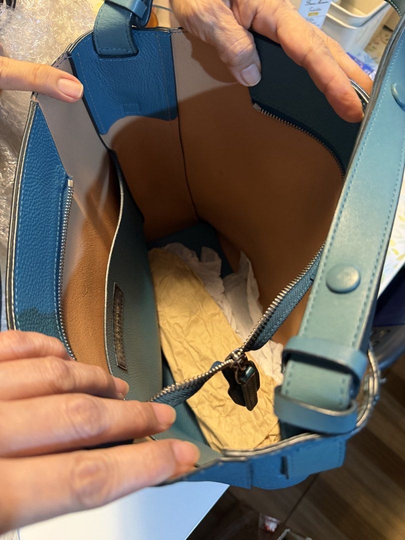 Beanpole Blue Leather Bucket Shoulder Bag (Category: Shoulder Bags) located in Manila. Submitted by fitandshop (Listing ID 1470874137, Image 3). Description: - Brand: Beanpole - Style: Bucket bag in a gorgeous teal blue shade - Material: Premium pebble leather exterior - Interior: Clean tan lining with a convenient zipped side pocket - Strap: Adjustable shoulder strap secured with snap buttons - Condition: Well-maintained, clean interior, and stu
