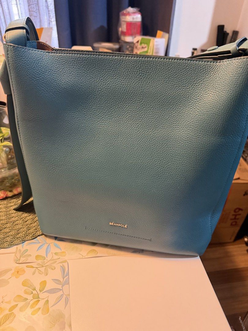Beanpole Blue Leather Bucket Shoulder Bag (Category: Shoulder Bags) located in Manila. Submitted by fitandshop (Listing ID 1470874137, Image 1). Description: - Brand: Beanpole - Style: Bucket bag in a gorgeous teal blue shade - Material: Premium pebble leather exterior - Interior: Clean tan lining with a convenient zipped side pocket - Strap: Adjustable shoulder strap secured with snap buttons - Condition: Well-maintained, clean interior, and stu