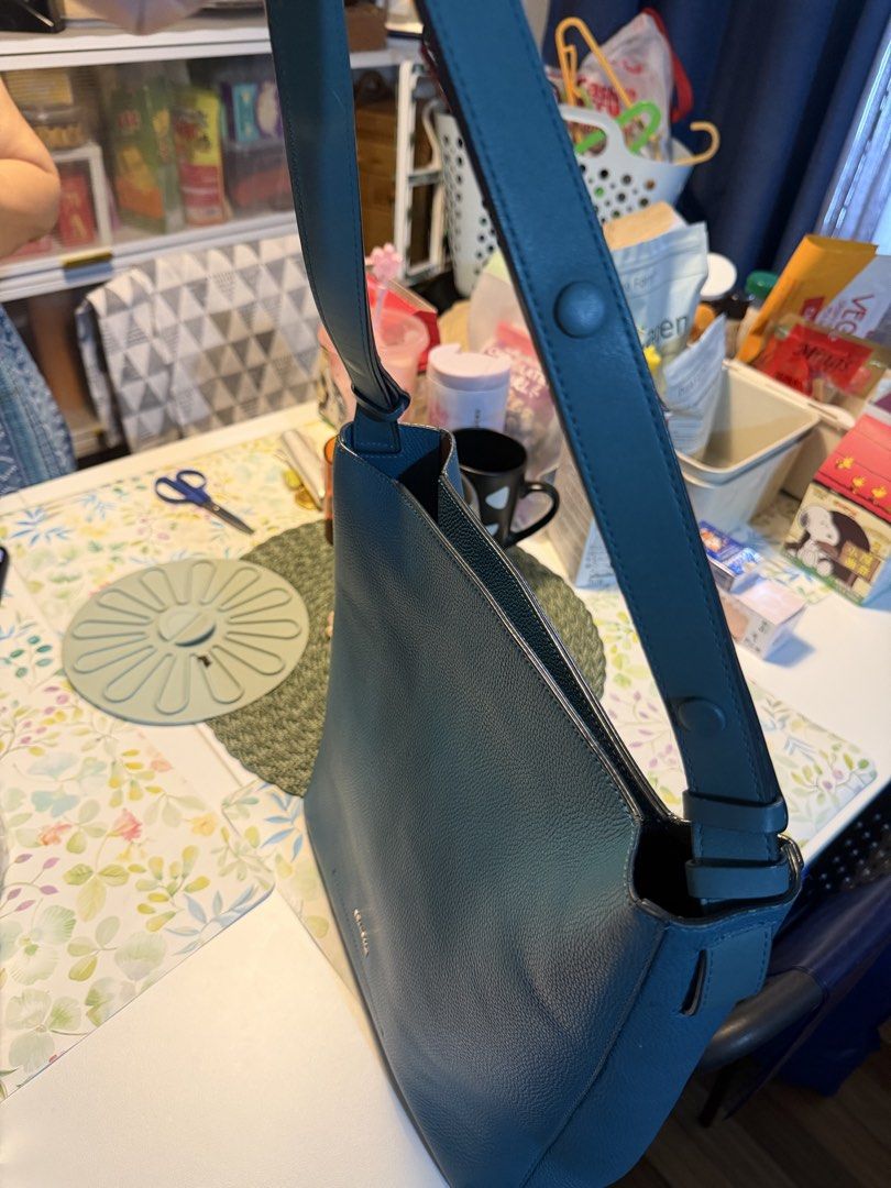 Beanpole Blue Leather Bucket Shoulder Bag (Category: Shoulder Bags) located in Manila. Submitted by fitandshop (Listing ID 1470874137, Image 2). Description: - Brand: Beanpole - Style: Bucket bag in a gorgeous teal blue shade - Material: Premium pebble leather exterior - Interior: Clean tan lining with a convenient zipped side pocket - Strap: Adjustable shoulder strap secured with snap buttons - Condition: Well-maintained, clean interior, and stu