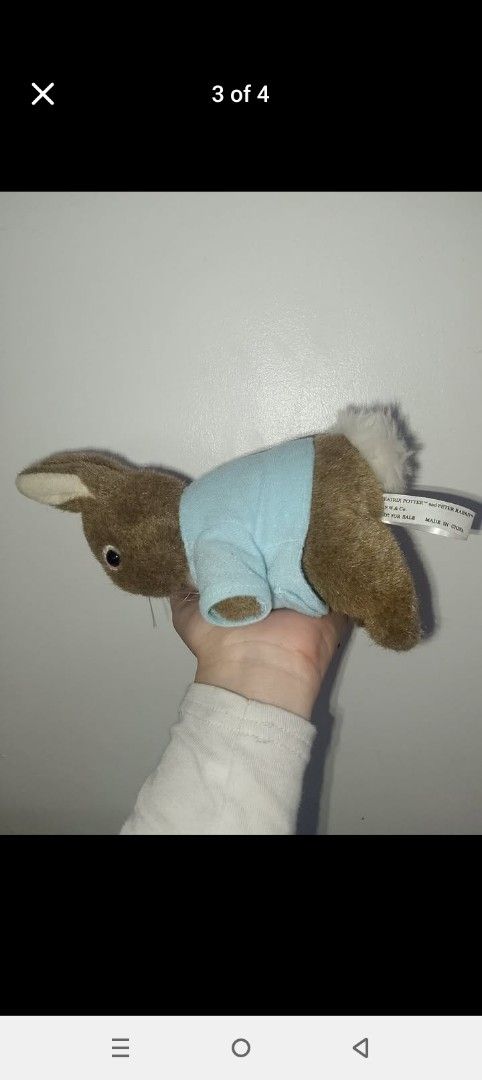 Beatrix Potter Peter Rabbit Plush Toy with Blue Jacket (Category: Plushies & Soft Toys) located in Cavite. Submitted by p8673 (Listing ID 1470750293, Image 2). Description: - Official Beatrix Potter Peter Rabbit stuffed toy - Wears the signature light blue jacket with button details - Made with soft brown plush fur and a white fluffy tail - Original 'F.W & Co.' tag attached (marked 'Not for sale') - Clean fabric and intact stitching.