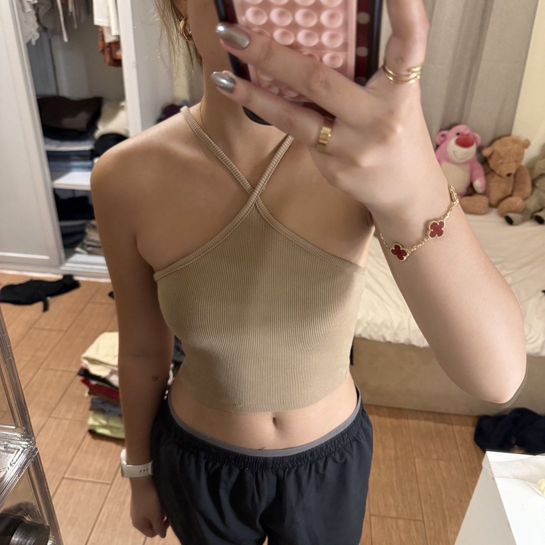 Beige ribbed halter neck crop top (Category: Sleeveless) located in Quezon City. Submitted by s0l4nge (Listing ID 1470881911, Image 1). Description: - Color: Beige - Style: Halter neck with trendy criss-cross straps - Material: Soft, stretchy ribbed knit - Fit: Form-fitting, cropped length - Condition: Clean and ready to wear.