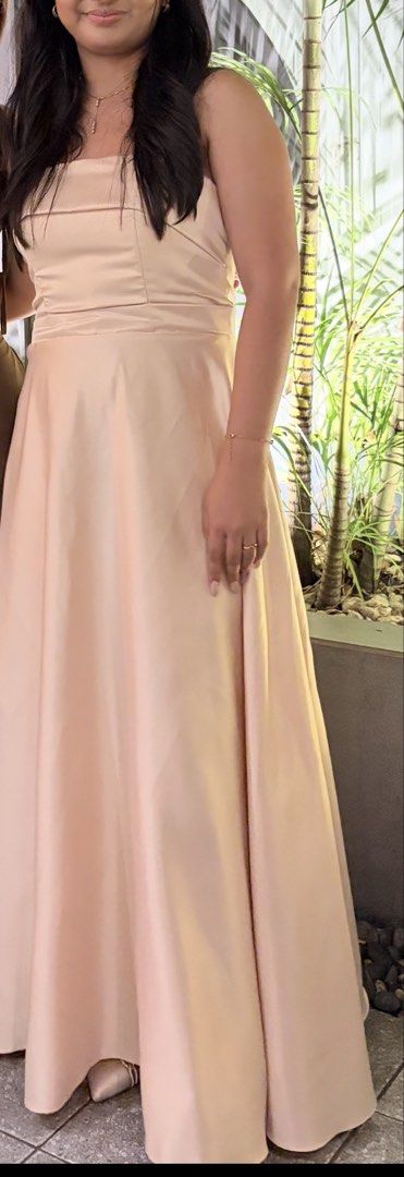 Beige Satin Formal Gown Corset Back (Category: Evening dresses & gowns) located in Quezon City. Submitted by angelajuliet__ (Listing ID 1470776705, Image 1). Description: - SELLING MY GRAD DRESS - Color: Beige - Material: Smooth satin finish - Design: Strapless sweetheart neckline with structured bodice panels - Fit: Adjustable lace-up corset tie at the back for a customizable fit - Skirt: Full, flared floor-length skirt with elegant pleating at 