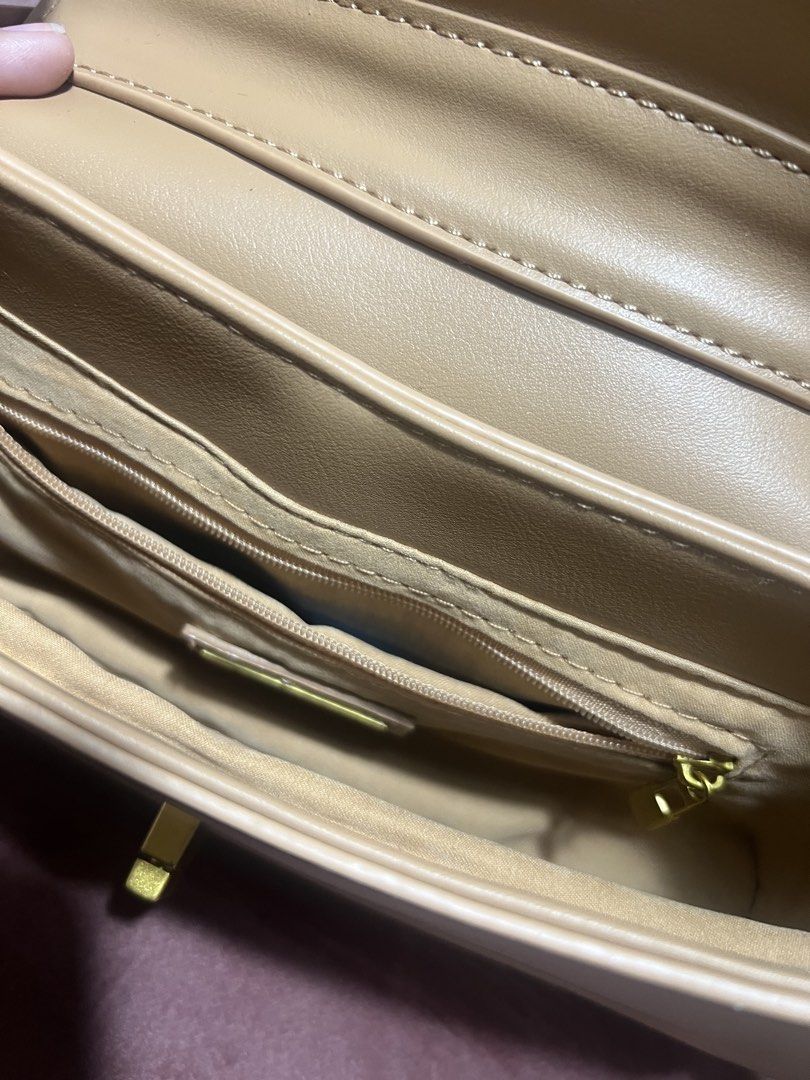 Beige Shoulder Bag with Gold Hardware (Category: Shoulder Bags) located in Manila. Submitted by malggg (Listing ID 1470881939, Image 3). Description: (Making space for new things!) Gifted to me but I haven’t had the chance to use it yet, so I might just well sell :) Brand new (but without a tag anymore!) and stored well. 1 main compartment, 1 pocket, and 3 card slots. MOD: Grab/Lalamove same-day delivery (within Metro Manila), J&T (outside Metro 